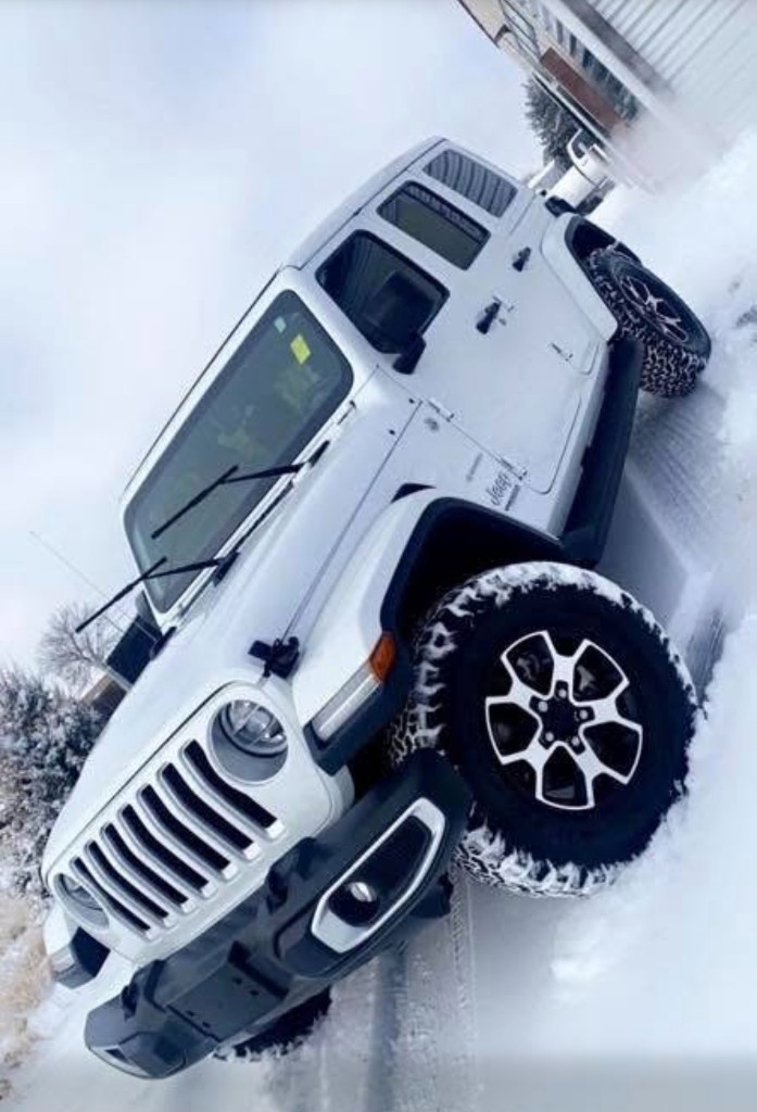 Clean white Jeep Wrangler after detail