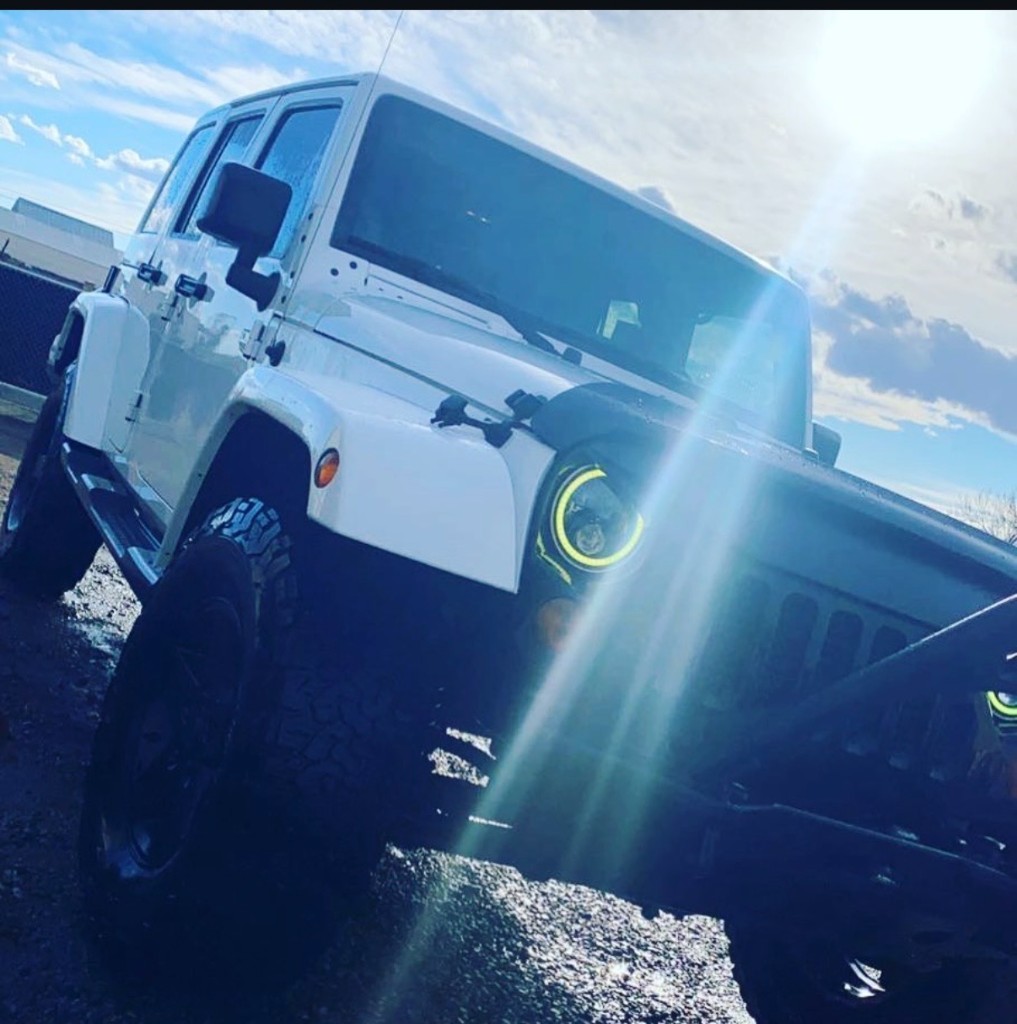 White Jeep Wrangler with tinted windows